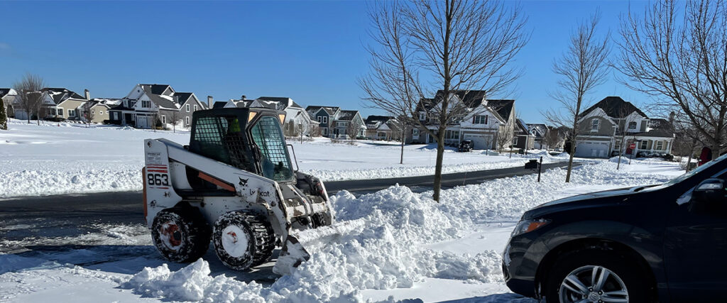 Robbie Moore and his Bobcat cleared a lot of driveways in this neighborhood after the weekend storm.